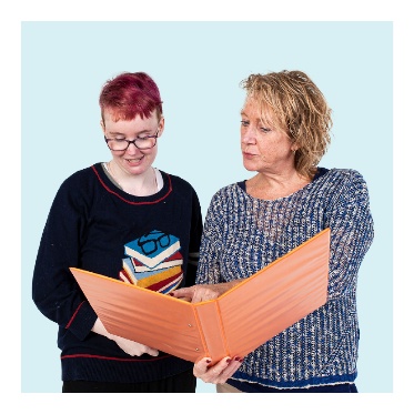 A person showing information to someone else in a folder.