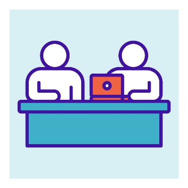 2 people working at a desk. 1 of them has a computer.